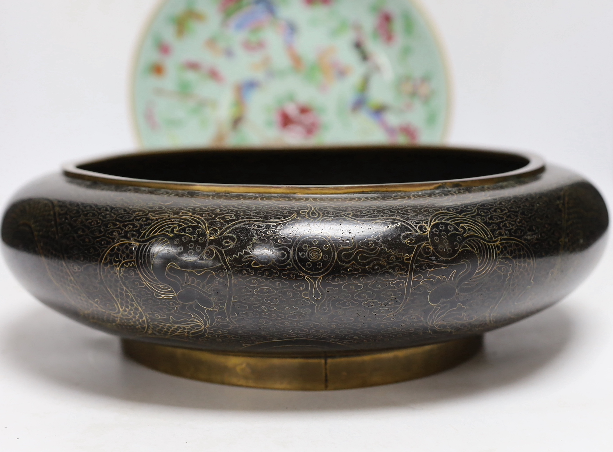 A Chinese famille rose plate and a cloisonné enamel bowl, bowl 30cm diameter